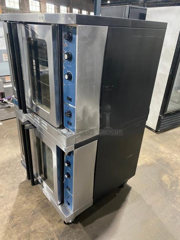 Duke Manufacturing stainless steel double-stacked convection oven, natural gas, thermostatic controls, oven racks, on casters.