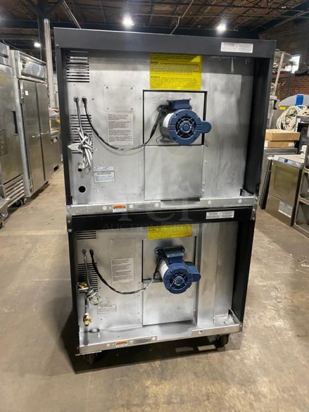 Duke Manufacturing double-stacked stainless steel convection oven, natural gas, thermostatic controls, with wired racks, on casters.