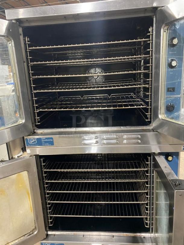 Duke Manufacturing stainless steel double stacked convection oven, natural gas, thermostatic controls, wired racks, on casters.
