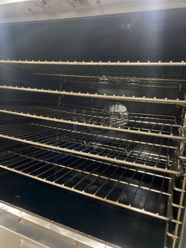 Duke Manufacturing commercial stainless steel double-stacked convection oven with thermostatic controls and wired racks.