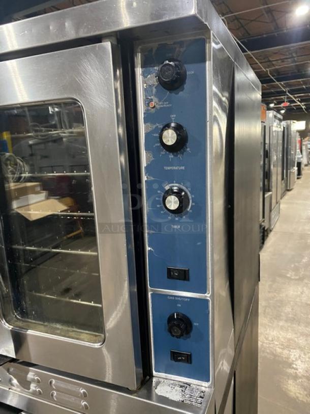 Duke Manufacturing stainless steel double-stacked convection oven, natural gas powered, with thermostatic controls, on casters.