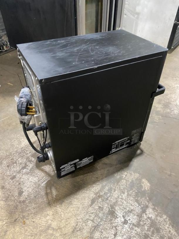 MerryChef late model black electric countertop rapid cook oven, 208/240V, excellent condition, commercial use labels visible.