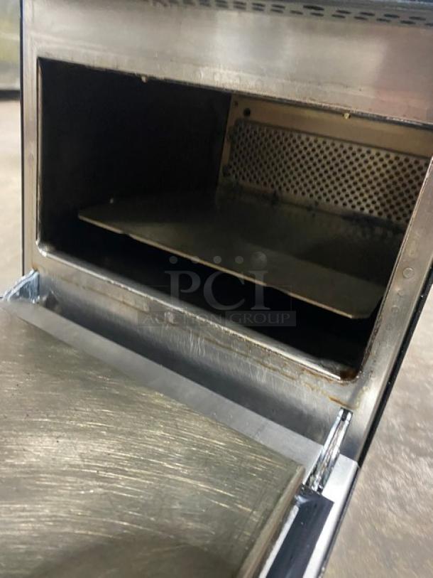MerryChef commercial high-speed countertop oven, black, electric, 208/240V, 1 phase, interior view, signs of use.