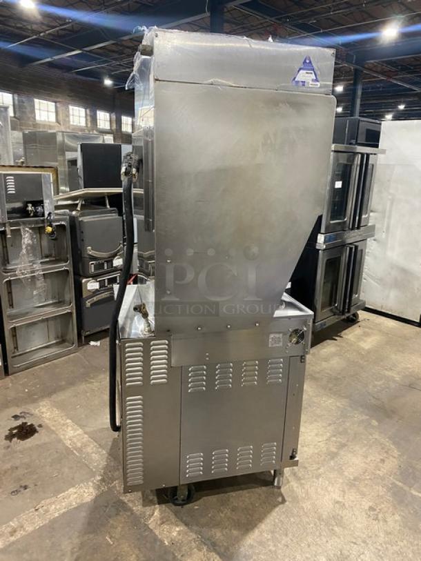 Wells VCS2000 stainless steel ventless cooking system with 4-French hot plate range, convection oven base, rear casters, front legs.