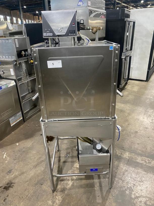 Commercial stainless steel electric dishwashing machine, Model ES2000, Energy Star certified, on legs, industrial setting.