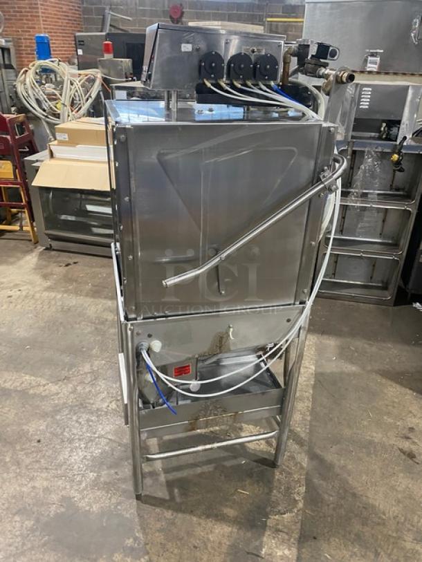 Commercial stainless steel dishwashing machine, Model ES2000, electric powered, on legs, Energy Star certified, used condition.
