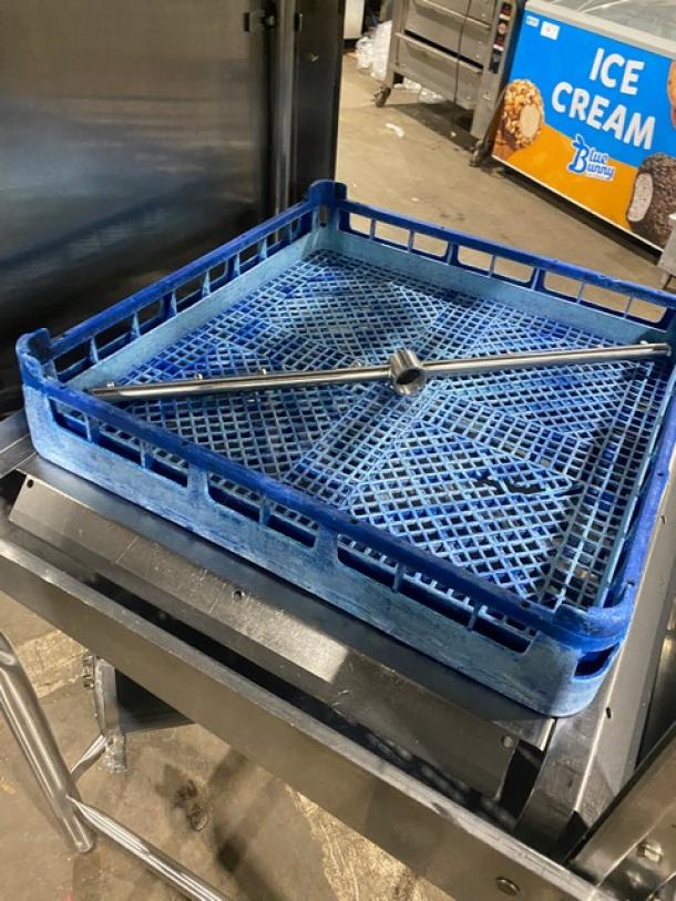 Commercial stainless steel electric dishwasher, Model ES2000, Energy Star certified, on legs; features blue rack.