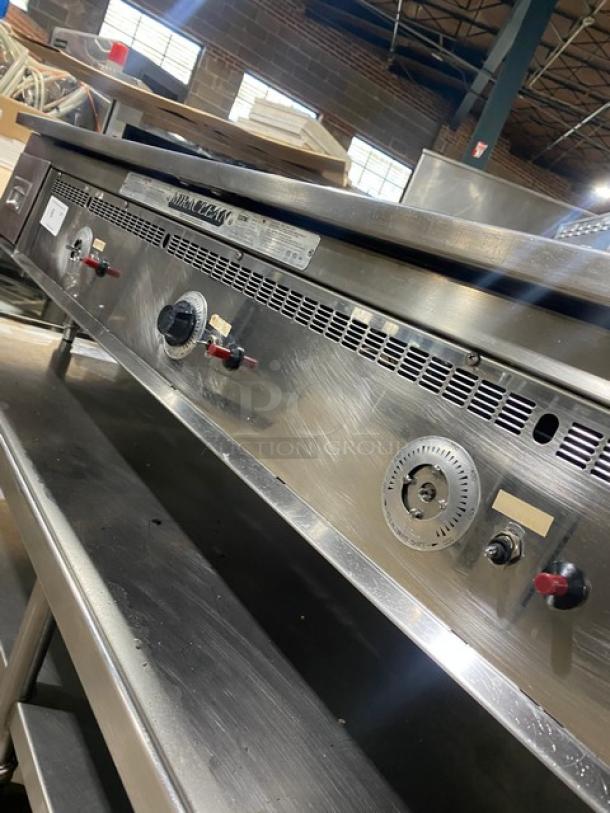 Keating Commercial Stainless Steel Natural Gas Flat Griddle, Model 60X30, with back and side splash, on casters.
