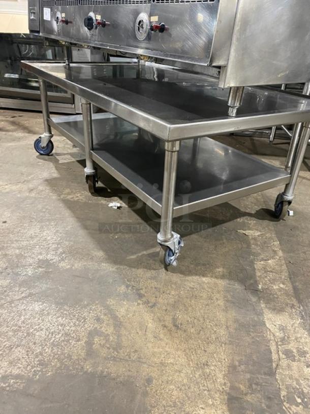 Keating commercial stainless steel natural gas flat griddle, model 60X30. Features back and side splash, single undershelf, on casters.