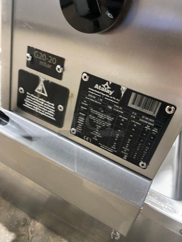 Atalay ADG5A stainless steel gyro machine with 5 burners, individual controls, and visible model/serial tags.