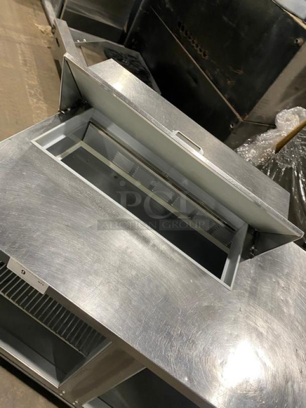 Beverage-Air SPE48HC-08 stainless steel 2-door refrigerated prep table on casters, with poly-coated wire racks.