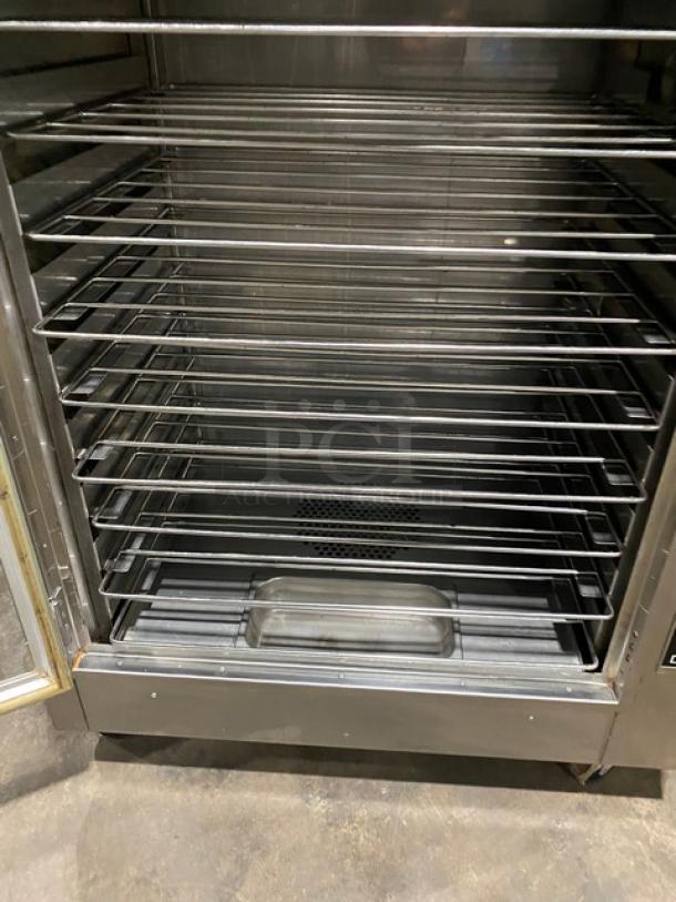 Nu-Vu OP-2FM stainless steel electric double stacked oven/proofer with thermostatic controls, wired racks, pan slides, on casters.