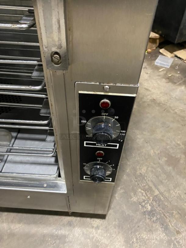Nu-Vu OP-2FM double stacked oven/proofer combo with thermostatic controls, wired racks, pan slides, and casters. Model SN: 28289.
