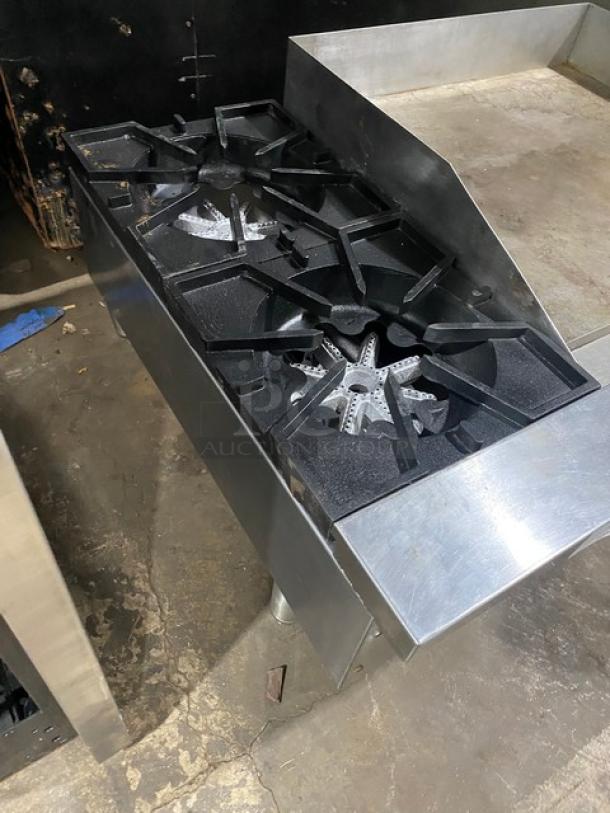 Comstock Castle stainless steel 2-burner griddle range, model FHP3624, with split top and side splash, on legs, lightly used.