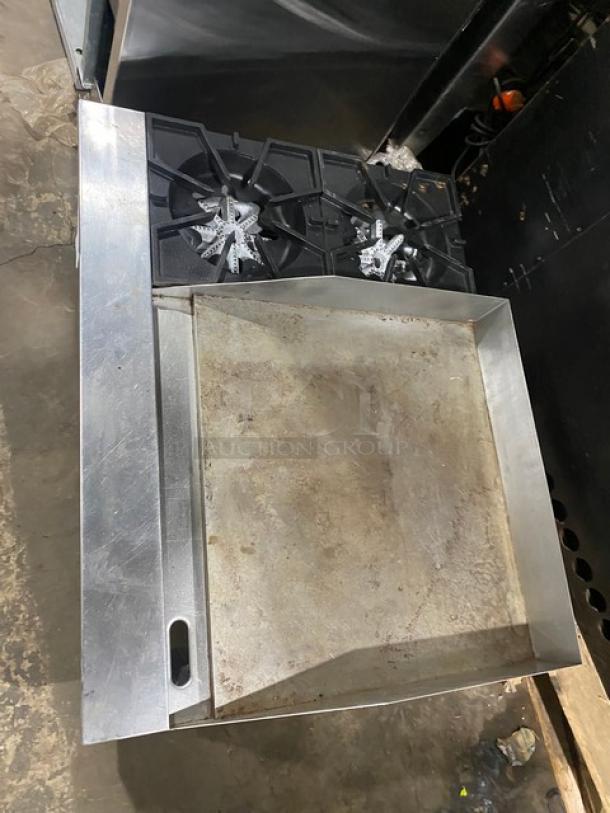 Comstock Castle FHP3624 stainless steel 2-burner split top griddle range with side splash. Natural gas, on legs. Used condition.