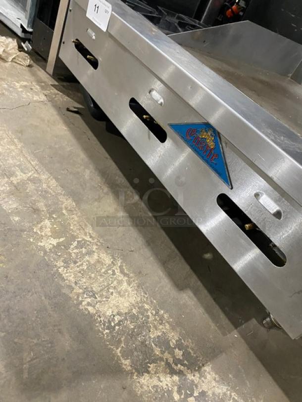 Comstock Castle stainless steel 2-burner split top flat griddle range, model FHP3624, with back and side splash, on legs.