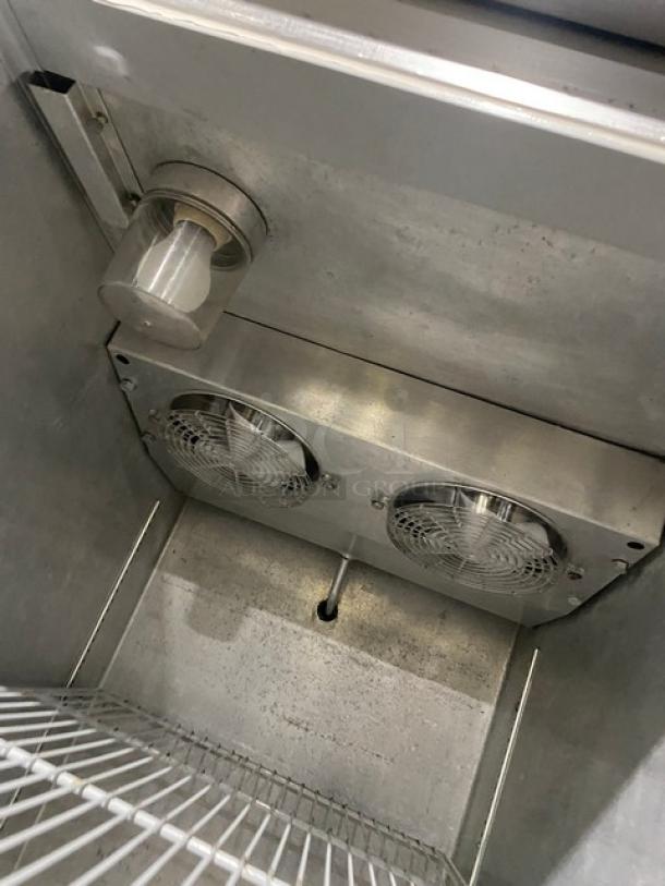 Continental Commercial Stainless Steel Refrigerator Model 1R interior. Features include poly-coated wire racks and dual fans.