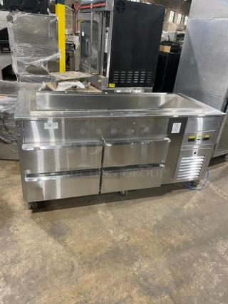 Commercial stainless steel 4-drawer refrigerated salad bar on casters; features temperature controls and a cold pan.