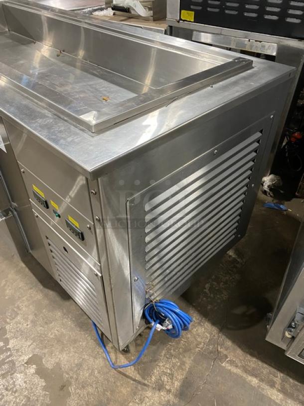 Commercial stainless steel 4-drawer refrigerated salad bar on casters, excellent condition, visible control panel and ventilation grates.