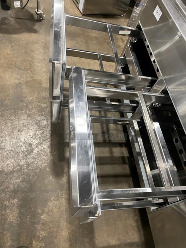 Commercial stainless steel salad bar with 4 refrigerated drawers, on casters. Durable, ideal for restaurants.