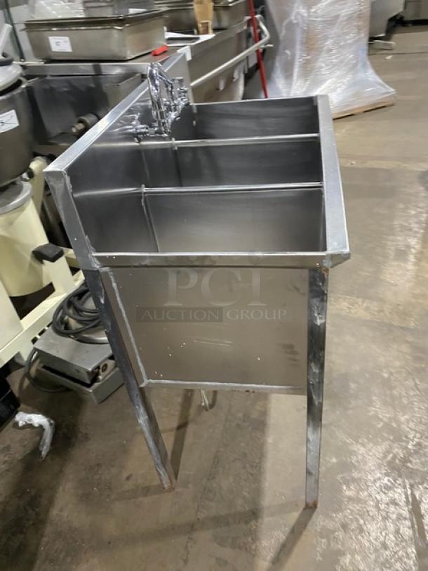 Commercial stainless steel 3-compartment prep sink with backsplash, swivel swing-spout faucet, on sturdy legs.