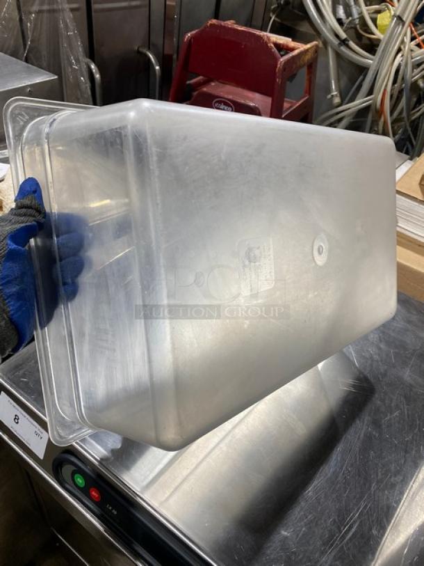 Cambro commercial clear polycarbonate food pan, lightly used. Features durable construction, rectangular shape, visible labeling.