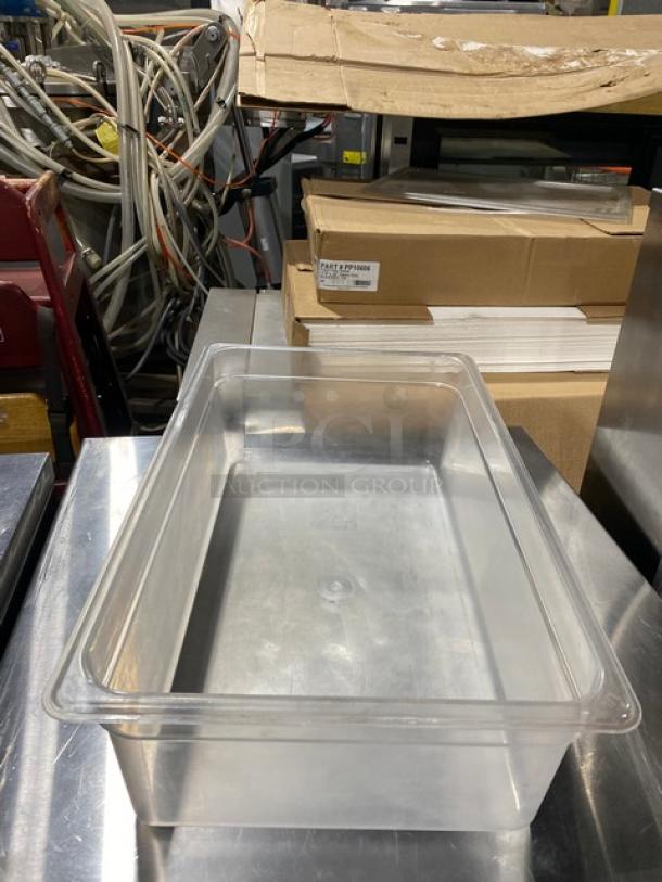 Cambro clear polycarbonate food pan, rectangular shape, excellent condition, right side up on metal table.