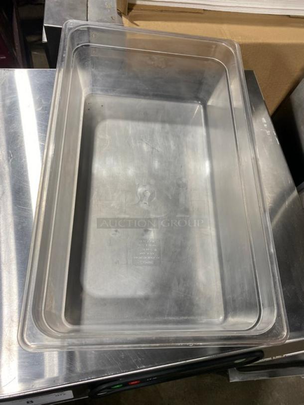 Cambro clear polycarbonate food pan, commercial grade, rectangular, slightly scratched, transparent, durability for food storage.
