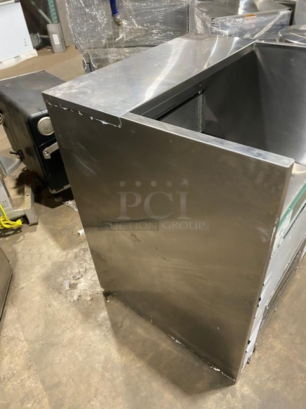 Cooltech stainless steel refrigerated open Grab-N-Go display case, commercial use, visible wear and scratches on surface.