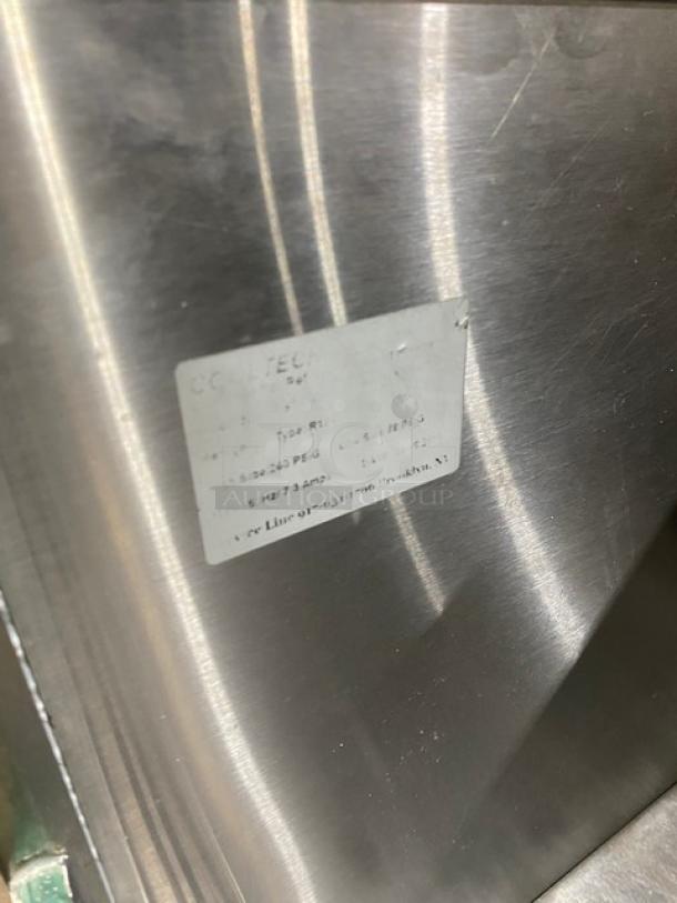 Cooltech stainless steel refrigerated open grab-n-go merchandiser display case with visible model label, showing specs.