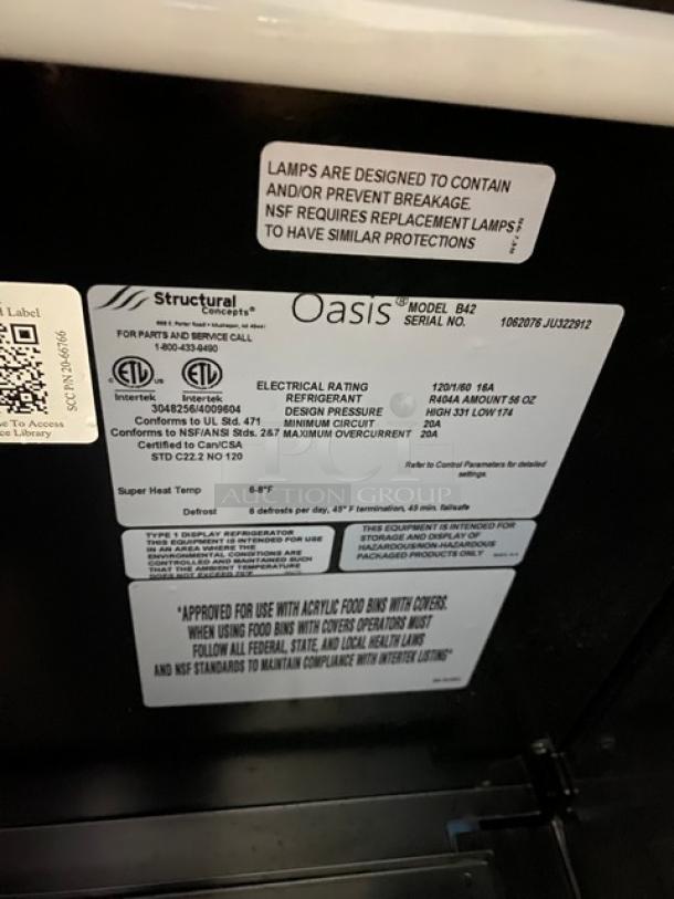 Structural Concepts Oasis Model B42 label, SN: 1062076 JU322912, 120V 1 Phase, indicating electrical specs and refrigeration details.