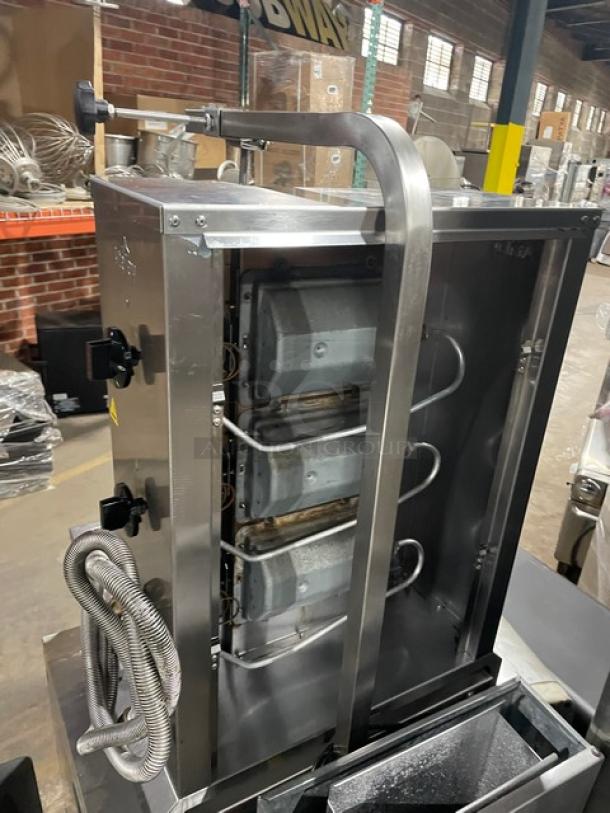 Atalay stainless steel countertop doner kebab machine with 3 burners, individual controls, and natural gas power, shown in a warehouse.