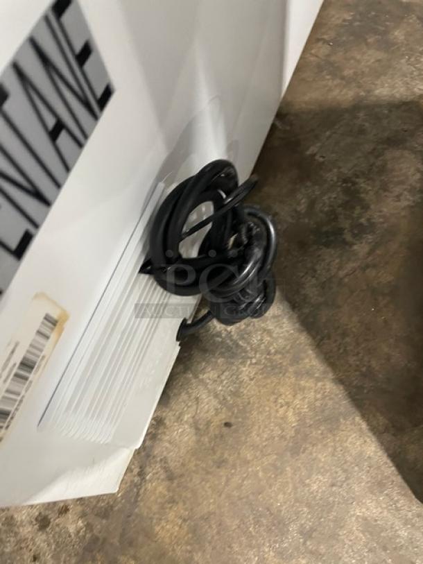 Insignia Commercial White 25" Chest Freezer, Model NS-CZ50WH0. Features visible tags and power cord.
