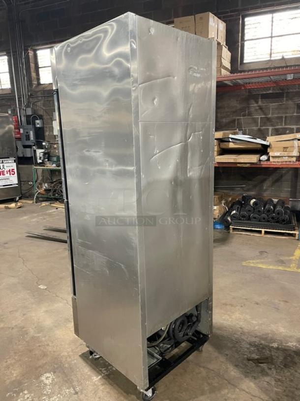 True T-23G-2 stainless steel, double glass half-door reach-in merchandiser refrigerator, on casters, 115V, poly-coated wire racks.