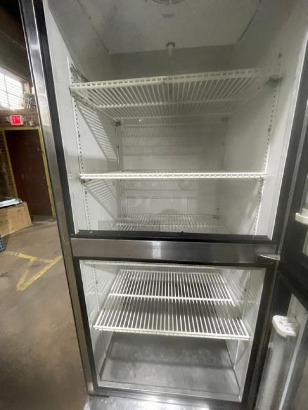 True T23G2 stainless steel glass door merchandiser refrigerator with poly-coated wire racks, on casters, model T-23G-2.