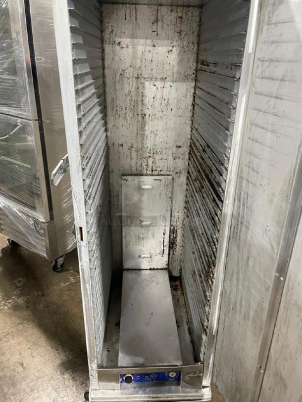 Precision full-height heated holding/proofing cabinet with pan slides, on casters. Shows signs of wear and rust.