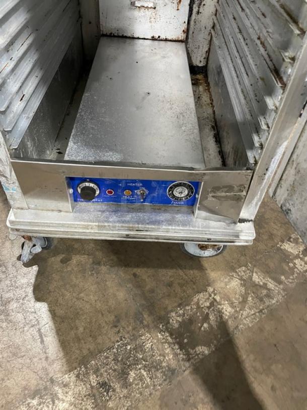 Precision full-height heated holding/proofing cabinet with built-in pan slides, on casters. Features control panel. Used condition.