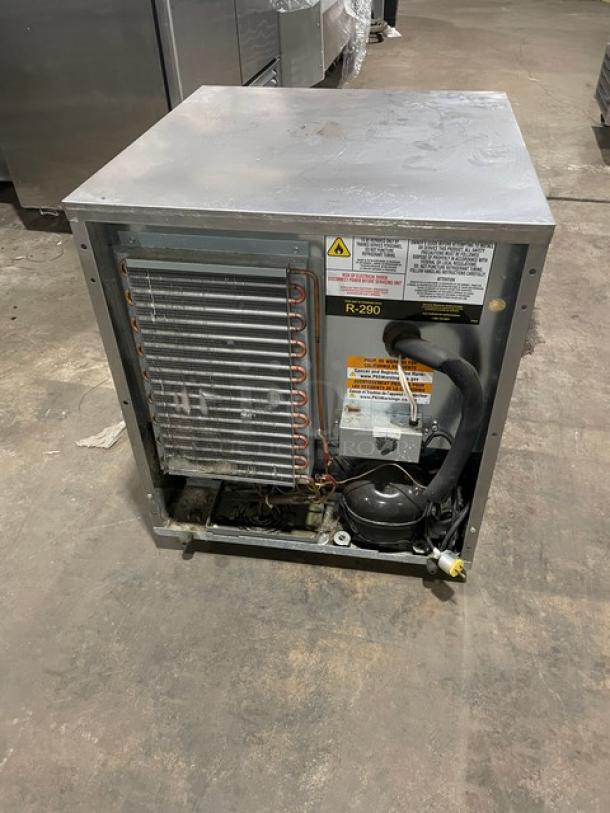 Delfield 406P-STAR2 undercounter refrigerator, stainless steel, single door, on casters, visible condenser, model label shown.