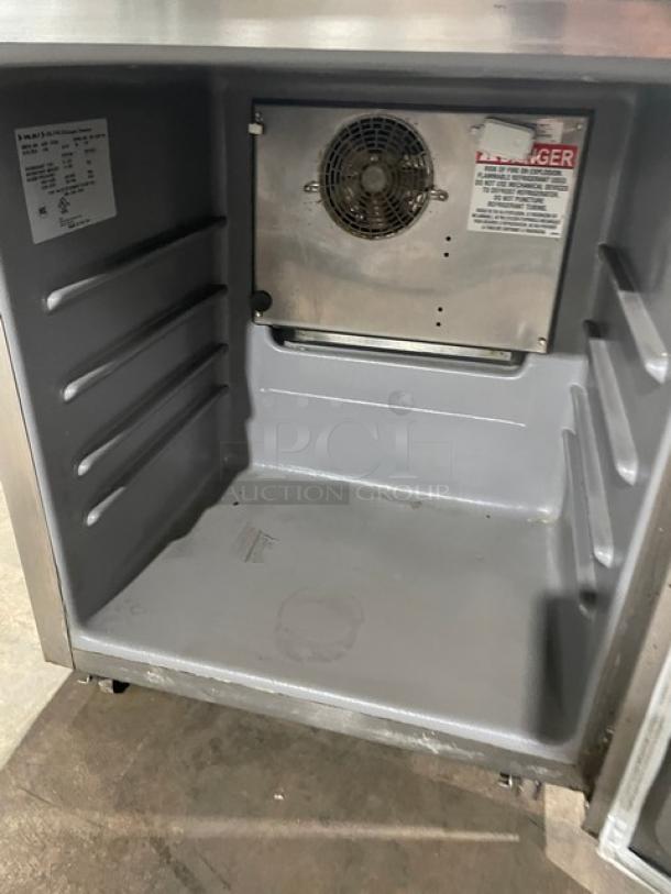 Delfield stainless steel undercounter fridge, Model 406P-STAR2, single door, 115V, on casters, interior view.