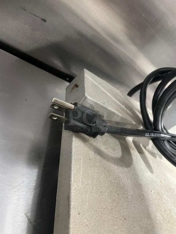 Hatco GRFFB Glo-Ray countertop food warmer with stainless steel body, overhead heating strip, 120V, electric plug visible.