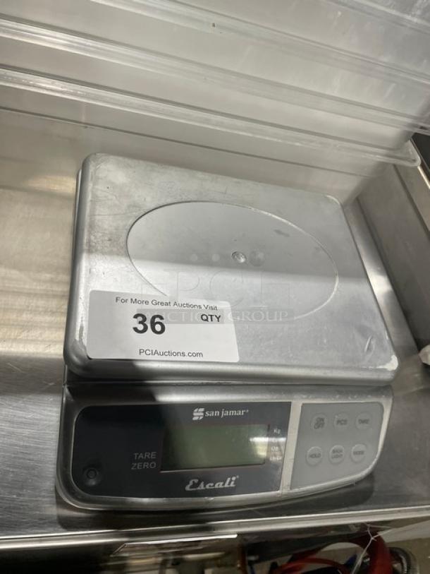San Jamar Escali SCDGM66 digital scale with 66 lb. capacity, stainless steel plate, model SCDGM66, on legs, excellent condition.