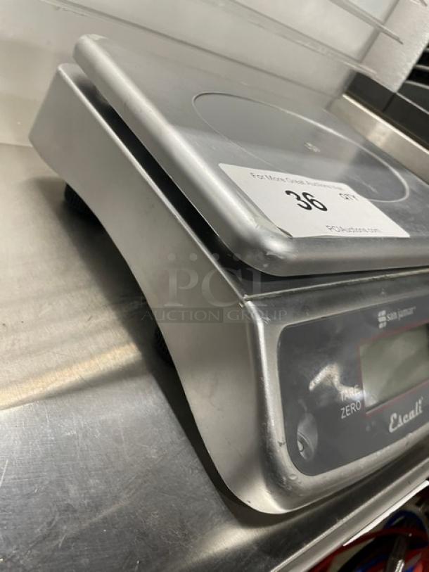 San Jamar Escali SCDGM66 digital scale, 66 lb capacity, stainless steel plate, on legs, used condition, visible label.