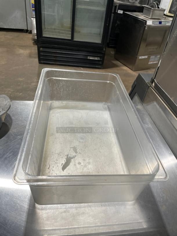 Clear polycarbonate food pan, commercial-grade, in used condition, rectangular shape. Ideal for kitchen or catering use.