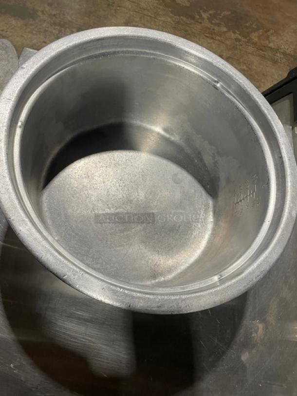 Vintage commercial aluminum rice cooker with cover, used condition, visible wear; ideal for collectors or restaurateurs.