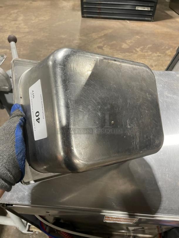 Lot of commercial stainless steel hotel steamtable pans, used condition. Auction label "40" visible on side.
