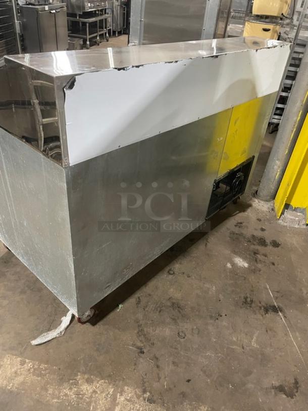 CoolTech 2022 stainless steel 2-door refrigerated pizza prep table, model CTR-60DR, on casters, in used condition.