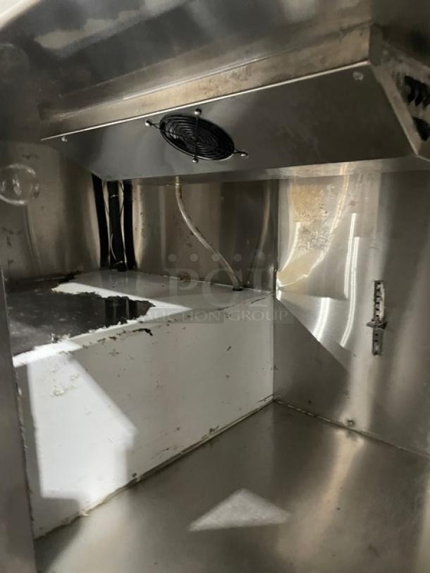 CoolTech CTR60DR stainless steel refrigerated prep table interior, showing cooling fan, wiring, and stainless surfaces.