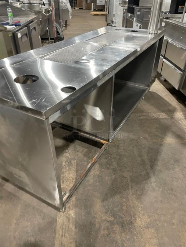 Custom commercial stainless steel beverage dispensing machine work station with double drain boards, enclosed cabinet base, on legs.