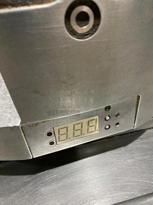 Caliente Industries Model A1 stainless steel electric tortilla press with digital display. Used condition. 115-125/208-240V.
