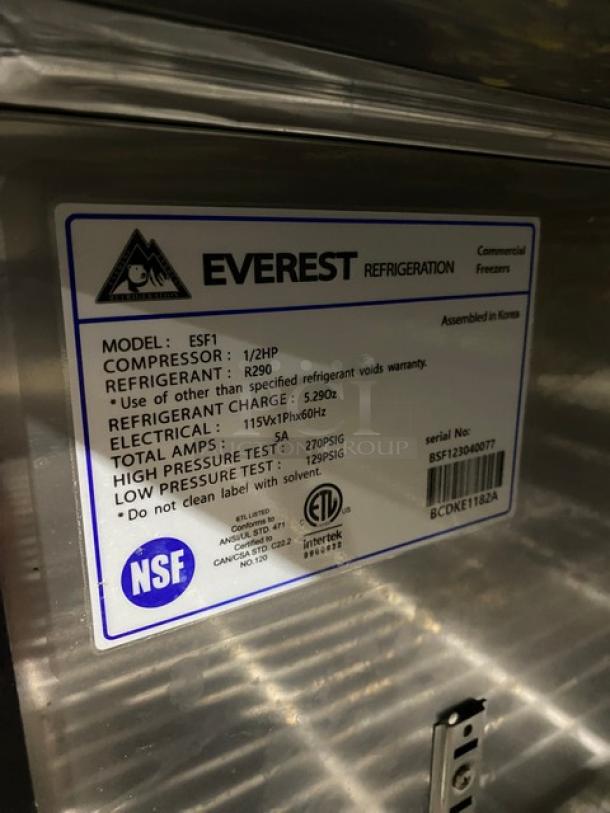 Everest ESF1 commercial stainless steel single swing door reach-in freezer with poly-coated wire rack. Model: ESF1, SN: BSF123040077. 115V 1 Phase, 1/2HP compressor, R290 refrigerant. Assembled in Korea, NSF certified.